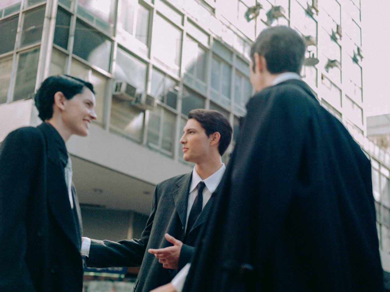 Three professionals in conversation